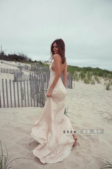 ຊຸດຫາດຊາຍ 2024 ແບບໃໝ່ Super Fairy Sexy Slim Suspender Backless Floor-length Dress Seaside Vacation Travel Photography Dress