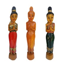 Thai imports of handmade wood carvings greet Bingu ladies welcome to Savardika figures at the mercy of two sets