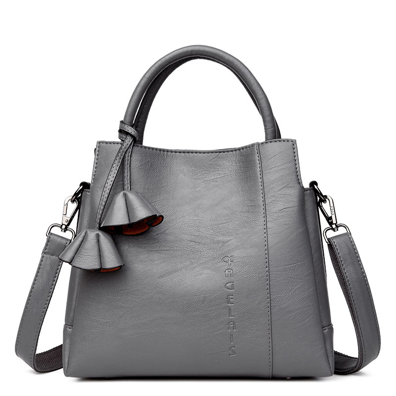 雅格莱诗水桶包2017新款韩版女包手提单肩斜跨大包中老年妈妈包包