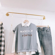 Clothing store display rack Gold wall hangers Wall hangers Childrens clothing mens and womens fashion store shelves Clothes racks