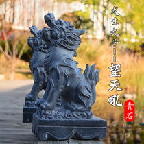 Stone carving green stone looking celestial roar a pair of pedaling dragon looks at the door town house to house the property and the unicorn stones towards the sky.