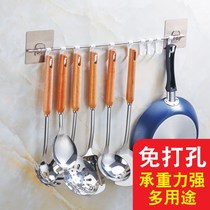 The hook for hanging things in the kitchen is free of perforated shovels The shelf special leaking spoon pan with spoon in a row of strips