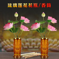 In front of the Buddha the home is dedicated to the Guanyin glazed vase for the Buddha. Lotus flower arrangement.