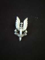 The British Sas Badge Brooch on the chest.