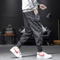 Striped casual pants man spring and autumn Han version of the trendy costume tide trousers is loose and full of nine pants