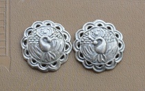 A pair of old silver phoenix-shaped flower ornaments