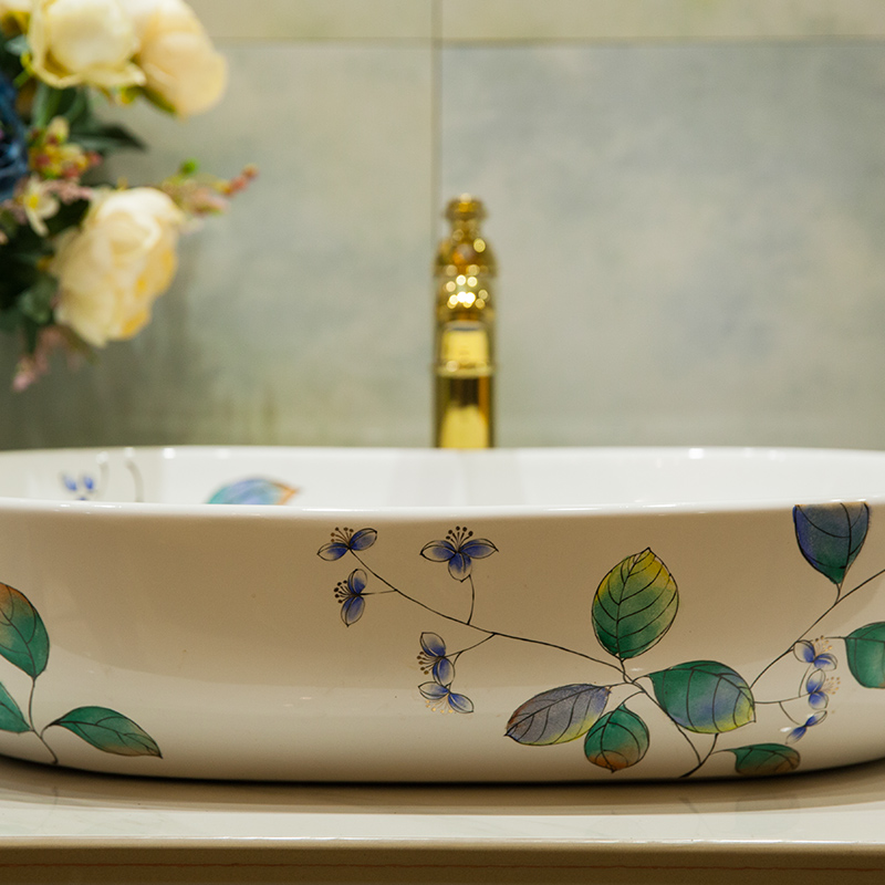 What king of toilet stage basin oval lavatory basin of household ceramic lavabo art hand - made green leaf