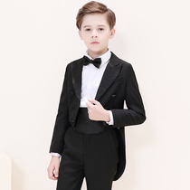 Childrens tuxedo boy gown suit with small flower boy wedding host The piano plays out the boy walking show suit