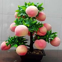 Flowers in front of the Buddha simulation flowers fake peach apple tree pots simple atmosphere hall tribute Buddha plastic flowers silk flowers living room decoration