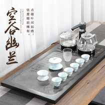 Wu Jinshi tea tray with electromagnetic stove integrated household tea table tea set irrigation canal milk tea bottle to take money to produce