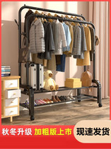 Bedroom with undressed clothes hanger on floor small short bed to put clothes on shelves removable hanger with wheels