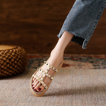 Slippers women wear 2021 new summer flat-bottomed wild fashion net red rivets word cool drag ins tide