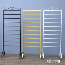 Flower shop containing rack flowers wrapping paper color with scarf silk towels fabric wall-mounted shelving shelving display shelves