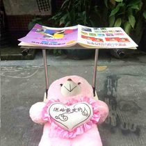 Lying flat on the bed sitting on the bookshelf putting the bookshelf on the reading shelf