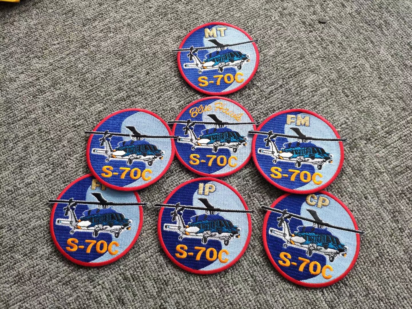 A set of 7 flight jacket badges for different specialties of S-70C helicopter unit