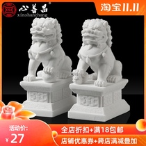A pair of stone lions at the door of the Cemetery ornaments