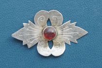 Old silver inlaid with old material flower decoration