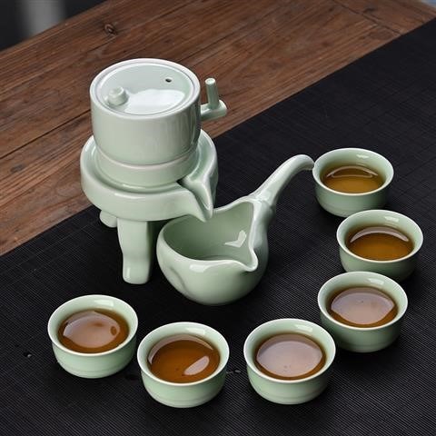 Tea set home stone mill creative ceramic teapot kung fu Tea cup half full automatic ⒅ ⒅.