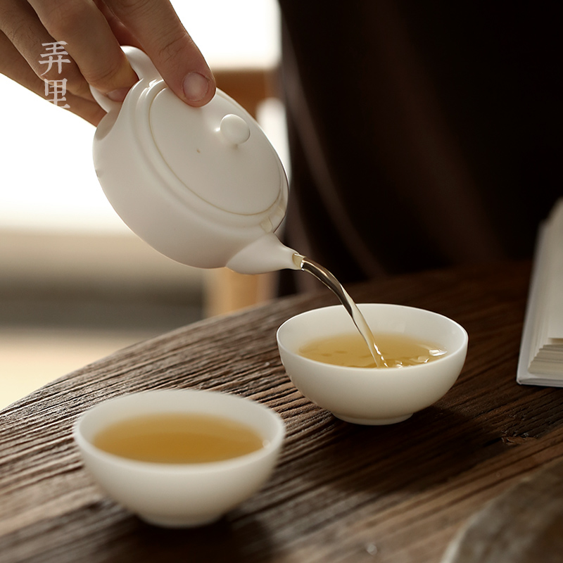 Travel tea set ceramic cups kung fu dehua white porcelain cup to crack a pot of two cups of Japanese portable teapot