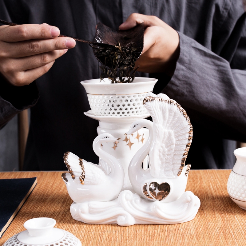 NiuRen exquisite hollow out half automatic ceramic kung fu tea set lazy household tureen tea to implement the hot
