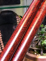 Two small leaves purple sandalwood old material water corrugated wooden stick with the hand to make the play material very good wave light clear