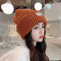 Hat female Japanese autumn and winter face small wild ear protection wool hat Korean knitted loose winter warm pile cap