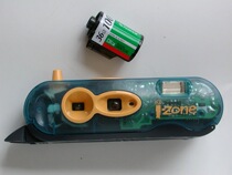 Collection: A transparent version of the Polaroid I-Zone camera with radio