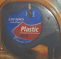 Promotional DYMO Yida electronic original label machine with SC91203 12mm * 4m black on red background