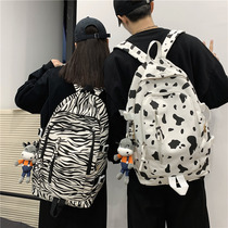 Cow pattern school bag female ins super fire cute girl canvas bag Korean version Harajuku ulzzang soft sister shoulder bag tide
