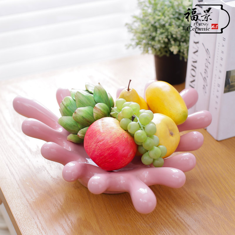 The scene household ornaments creative ceramic plate is placed palm fruit bowl dried fruit surroundings while snack plate decoration