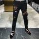 The new trend of men's personality Slim feet black hole in the head drilling hot pants jeans young men The new trend of men's personality Slim feet black hole in the head drilling hot pants jeans young men