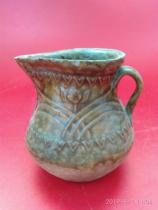 High ancient porcelain in the Song Dynasty Hutian Kiln hold a small jug (there are many bumps along the mouth)