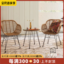 Nordic ins outdoor table and chair courtyard outdoor rattan tea table rattan chair three-piece balcony creative table chair combination