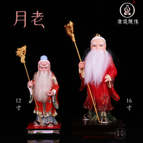 The old man of the moon is like the old man under the moon Buddha statue beckons marriage hand holding a red rope moon old ornament red rope to give a marriage god statue