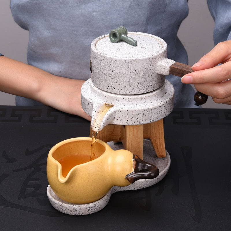 HaoFeng creative lazy stoneware kung fu tea set stone mill automatically restore ancient ways of a complete set of Japanese teapot cup suit