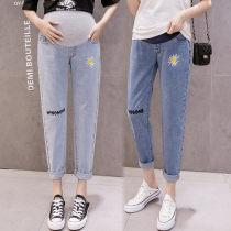 Pregnant pants Spring outside wear small chrysanthemum jeans loose hole belly pants Spring and summer Dad radish nine-point pants