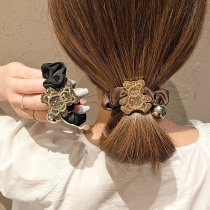 South Koreas East Gate with rhinestone bear head rope cute girl flash drill coliform ball ball head tie hair leather case