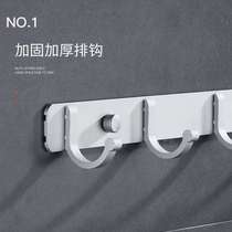 A row of long perforated aluminum wardrobes without kitchen hooks and sticky hooks behind the door with strong hooks for home use and space load-bearing adhesive