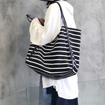 Hong Kong tide brand simple retro striped handbag womens 2022 new large-capacity fashion one-shoulder shopping bag