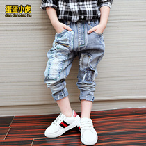 Childrens clothing boys casual pants Middle big children jeans trousers boys European and American grinding leather hole small feet pants tide
