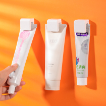 Creative adhesive toothpaste holder non-perforated bathroom facial cleanser hanger toilet skin care products hanging clip hook