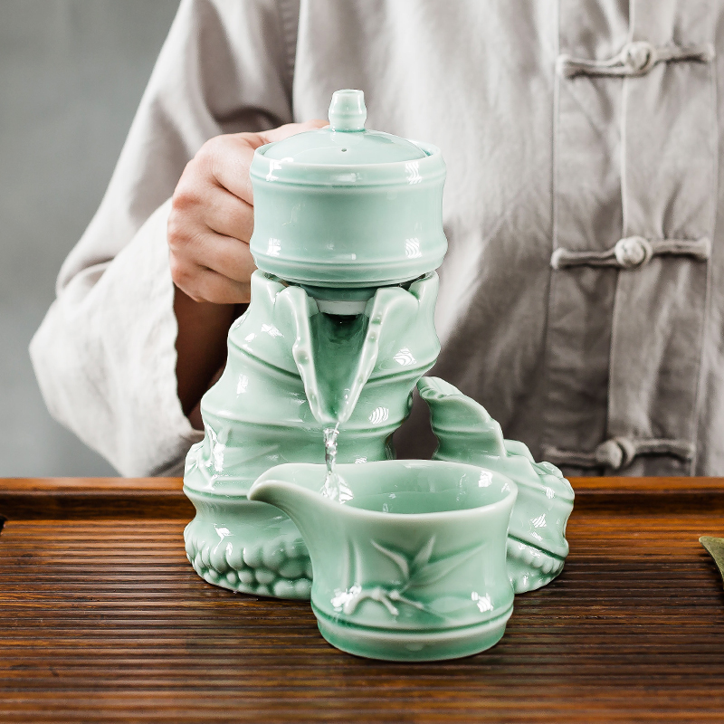 NiuRen creative ceramic celadon kung fu tea set the whole household contracted lazy semi - automatic tea teapot rotation