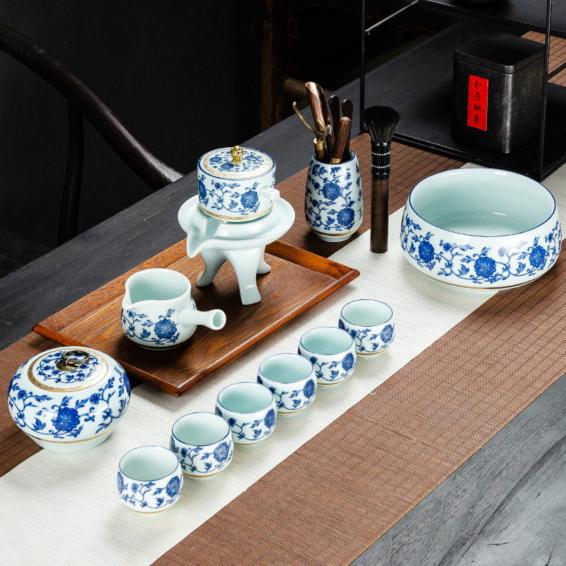NiuRen blue and white porcelain tea set suit household whole semi - automatic creative stone mill lazy kung fu tea tea cups