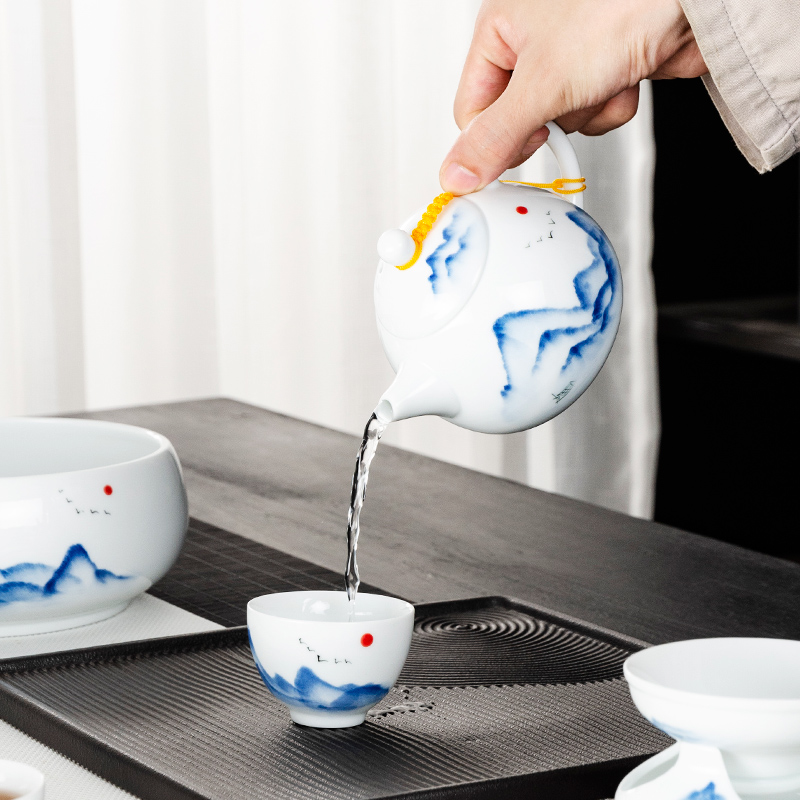 NiuRen white porcelain hand - made kung fu tea set home tea cup lid bowl tea to wash to the whole office tea sets