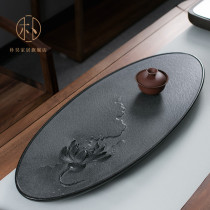 Park Hao whole piece of natural Wujin Stone tea plate Mountain West Black Tea Sea Drainage Master hand carved black gold stone tea table