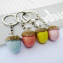 Creative stainless steel pine cone ceramic keychain pendant men and women Korea Jingdezhen ceramic jewelry