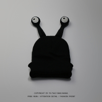 The clockwork bore the head wearing a big eye tentacle black wool cap.