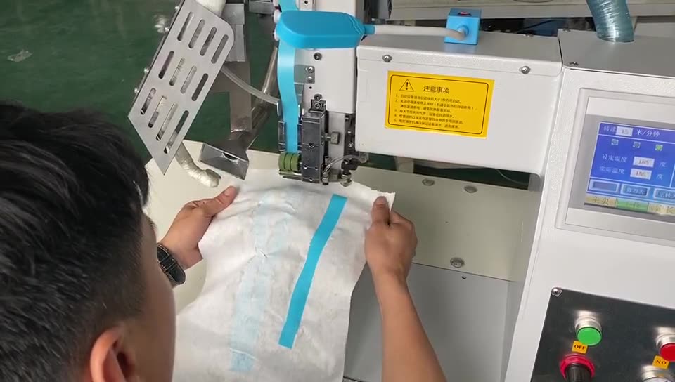 康成机械防护服密封压胶机 热风压胶机 雨衣热封机 隔离服贴条机