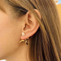 Stars with the same style before and after wearing four-leaf clover cross earrings female gold and silver color European and American cold style simple light luxury ear ornaments