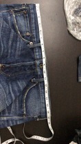 Change the waist of jeans in the clothing store to reduce the waist size and increase the waist size